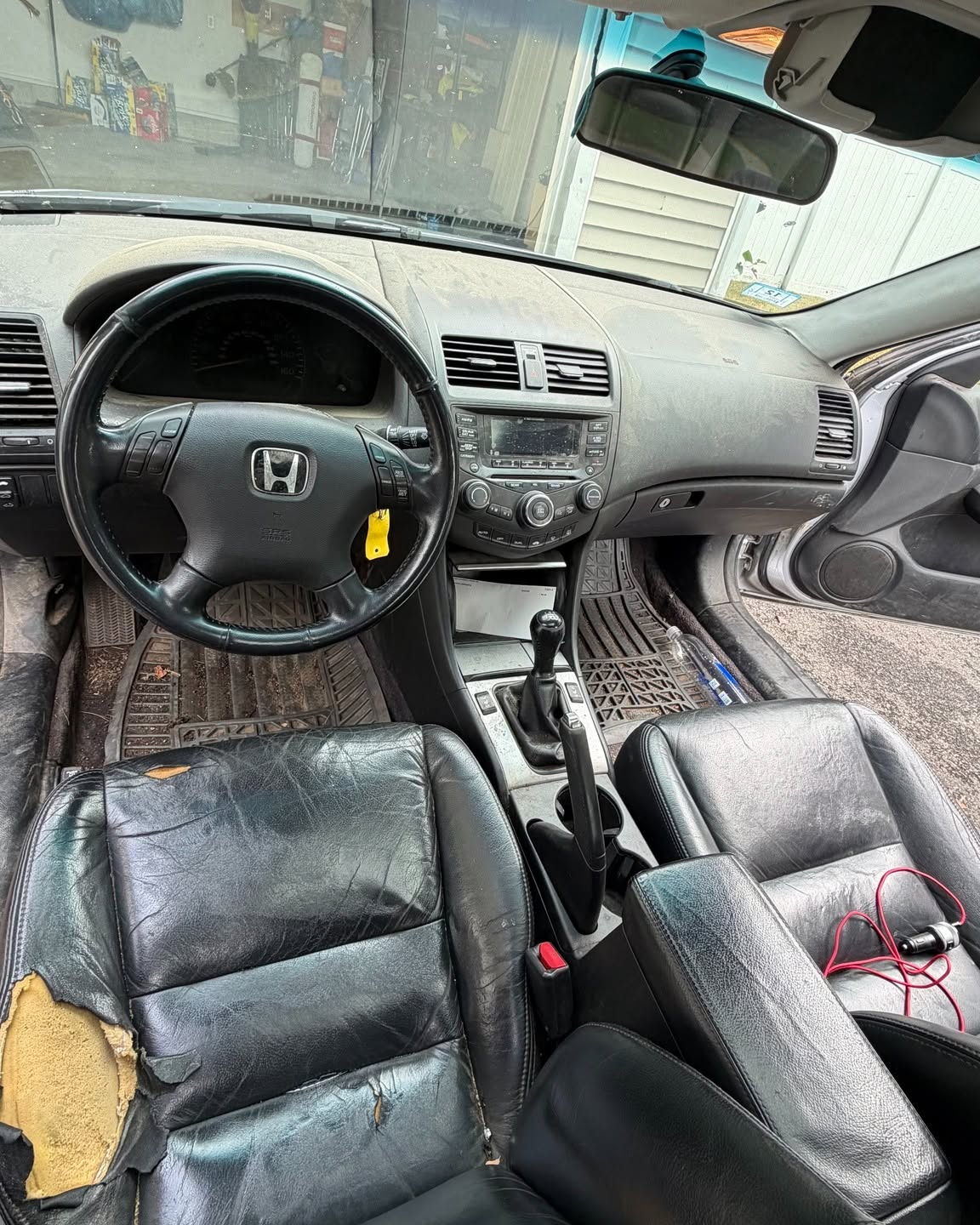 Dashboard and front cabin of a Honda Accord before detailing